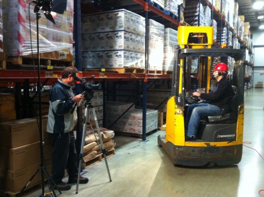 Mike Haller setting up the camera to tape a video plant tour.