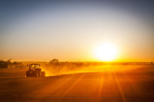 The American Farmer prepares his field as the new day begins!