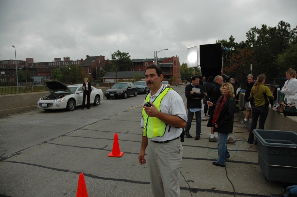 After scouting the perfect location - production manager with crew and talent.