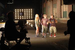 camera operator shooting music video at remote location