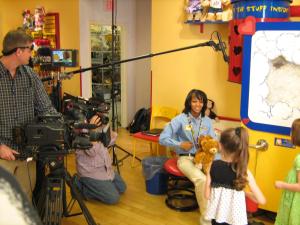 Videographer shooting talent at closed set retail location